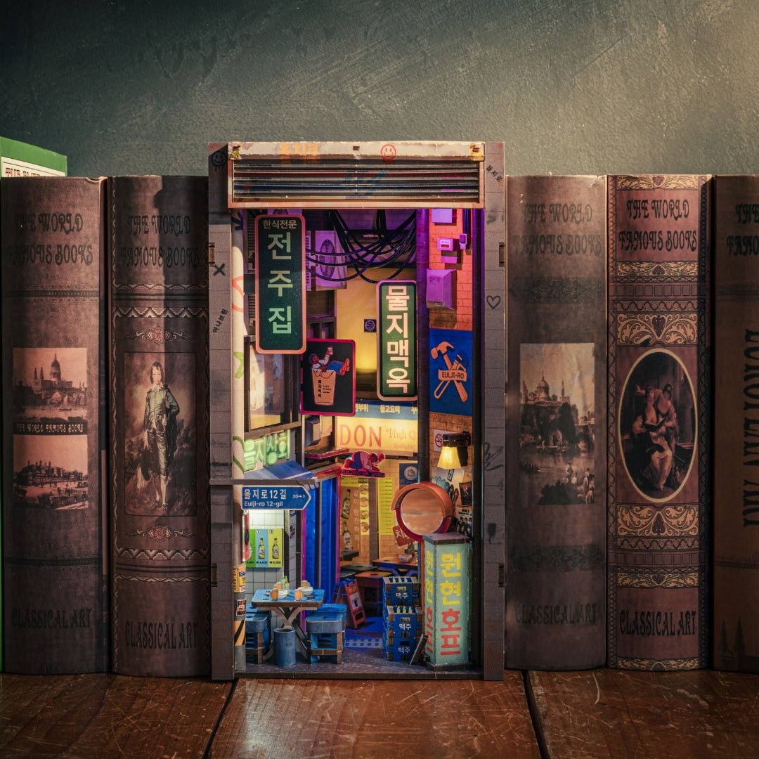 Seoul Hipjiro Book Nook Kit placed between books on a wooden shelf