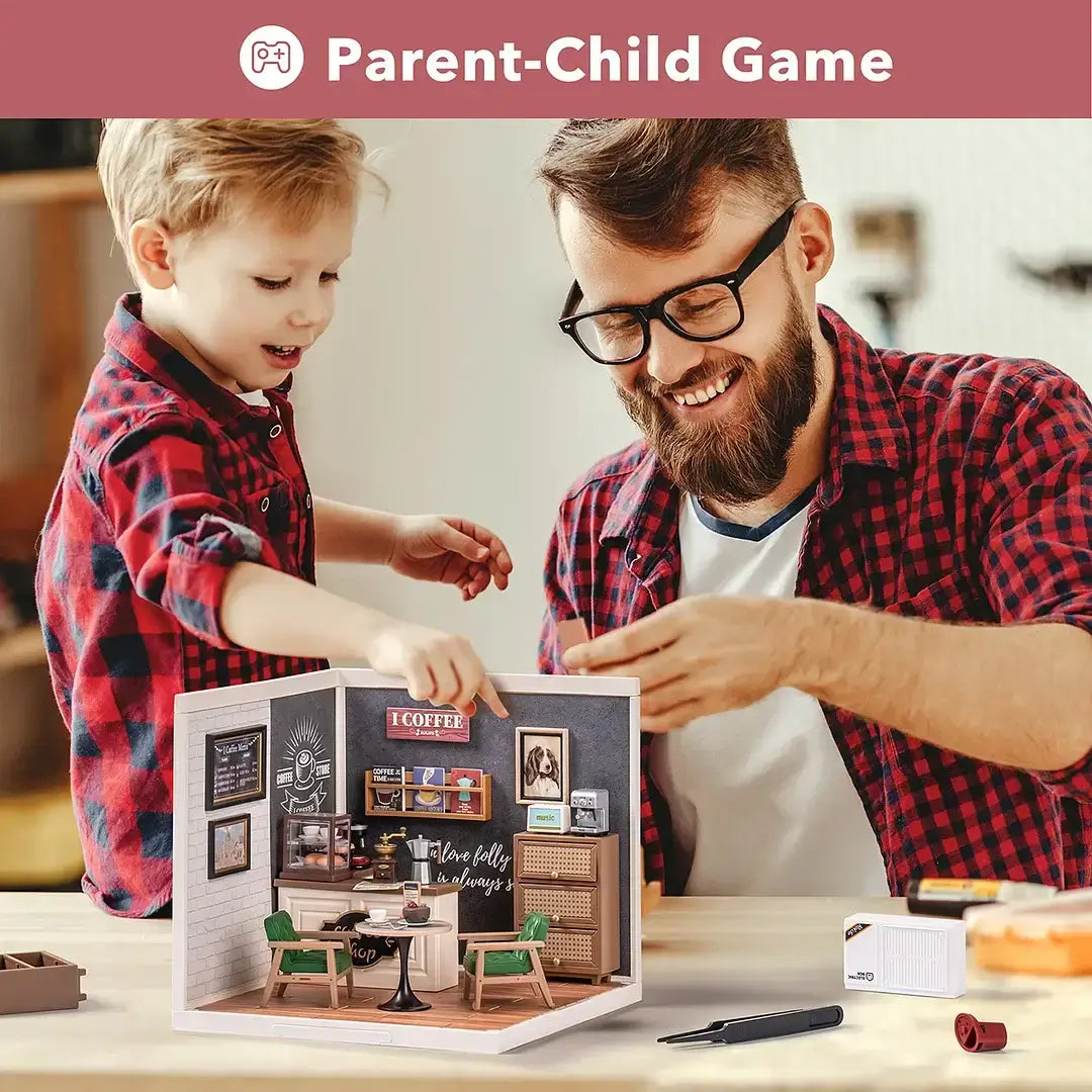 Parent and child enjoying building a Daily Inspiration Cafe DIY Plastic Miniature House together
