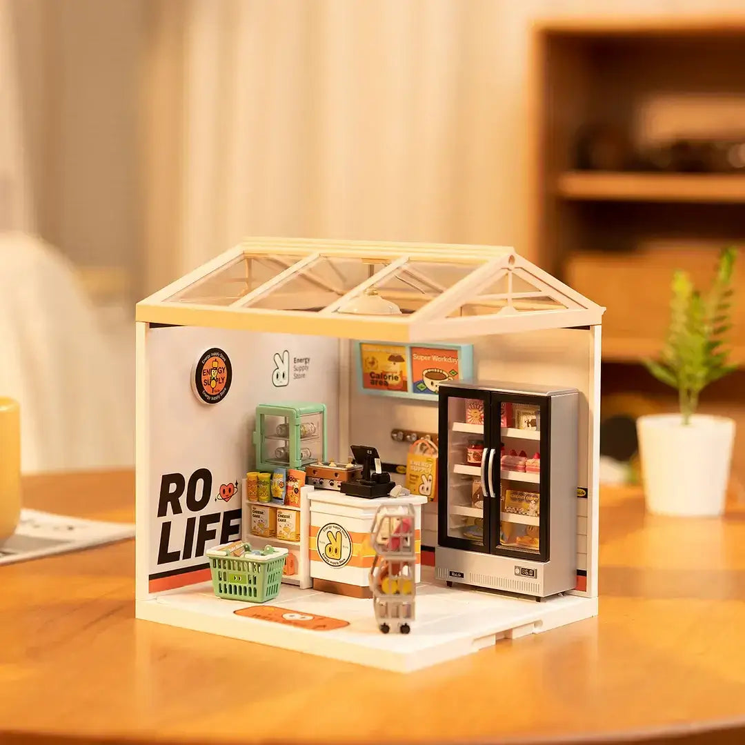 Energy Supply Store DIY Plastic Miniature House displayed on a wooden table, featuring detailed interiors like a fridge, shelves, and merchandise.