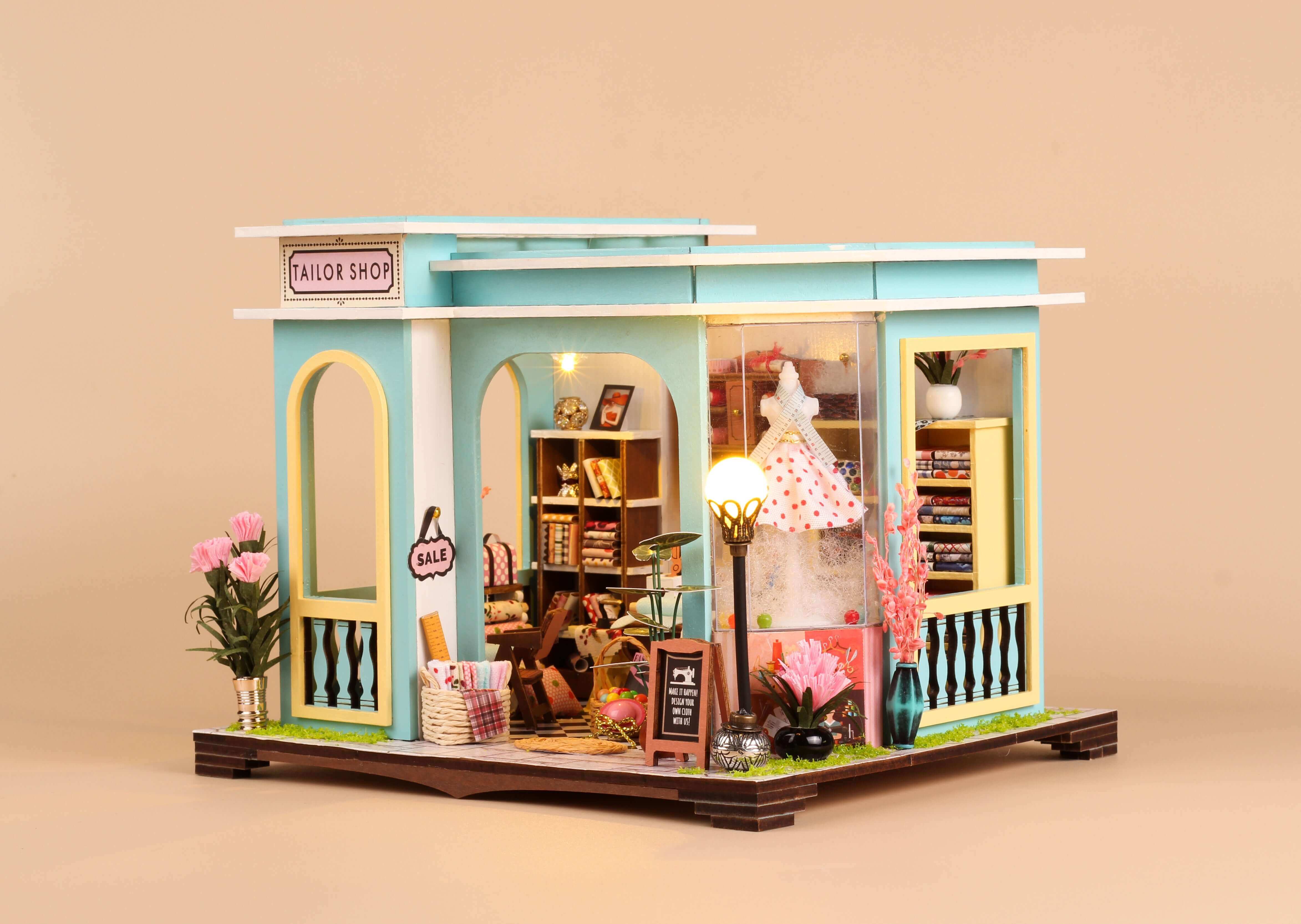 Tailor Shop DIY Miniature Dollhouse Kit with detailed interior showcasing sewing supplies and decor