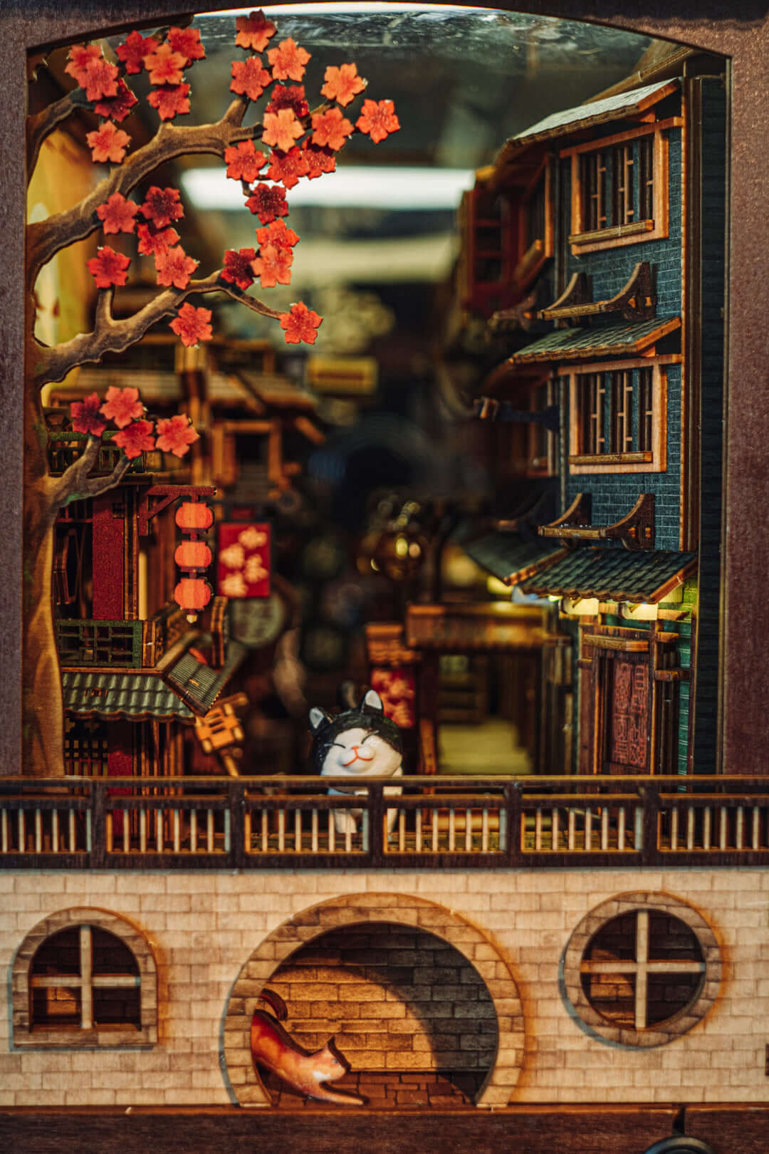 JiuFen Old Street DIY book nook kit featuring cherry blossoms, traditional Chinese roof tiles, vibrant lanterns, and a quaint seaside mountain town