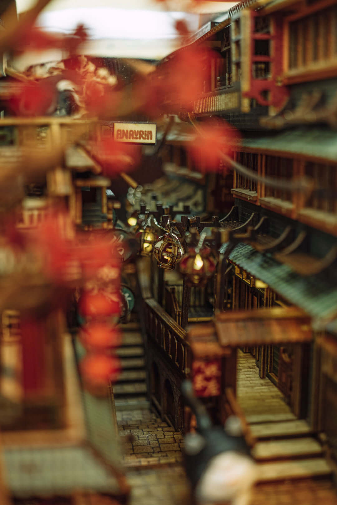 JiuFen Old Street Book Nook DIY kit showcases a detailed miniature of a Taiwanese seaside town with cherry blossoms, lanterns, and traditional roofs.