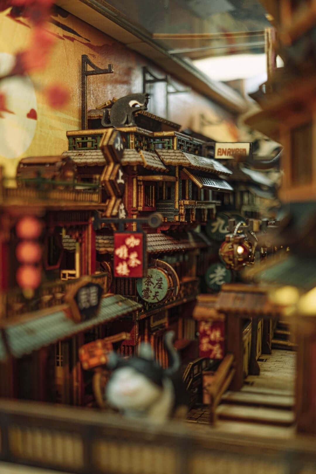 JiuFen Old Street DIY book nook kit showcasing charming storefronts, cherry blossoms, vibrant lanterns, and traditional Chinese roof tiles.