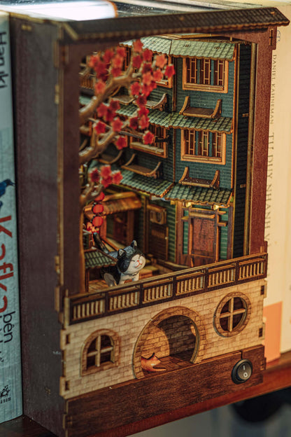DIY book nook kit of JiuFen Old Street with cherry blossoms and traditional Chinese architecture in a miniature scene