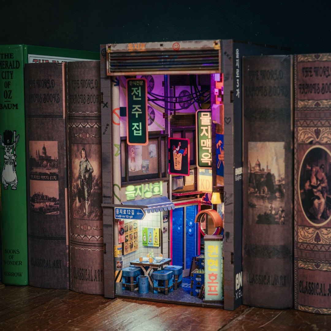 Seoul Hipjiro Book Nook Kit placed between books on a wooden shelf