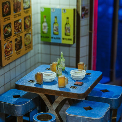 Miniature Korean bar setup featuring soju bottles and neon signage from the Hipjiro Book Nook Kit