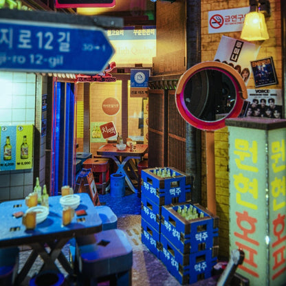 Detailed miniature storefronts with Korean signage and neon effects